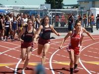 Action in Perlims of 4x100m relays at CCS as Erika B. passes to Addy E. in the final exchange.